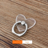 a heart shaped bottle opener on a wooden table