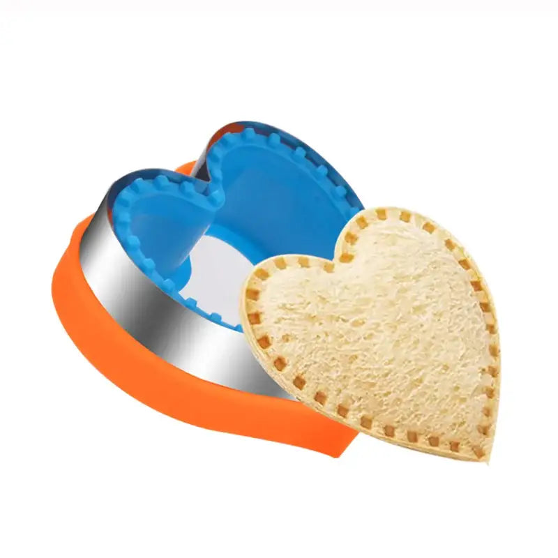a heart shaped cookie cutter with a cookie cutter in the middle