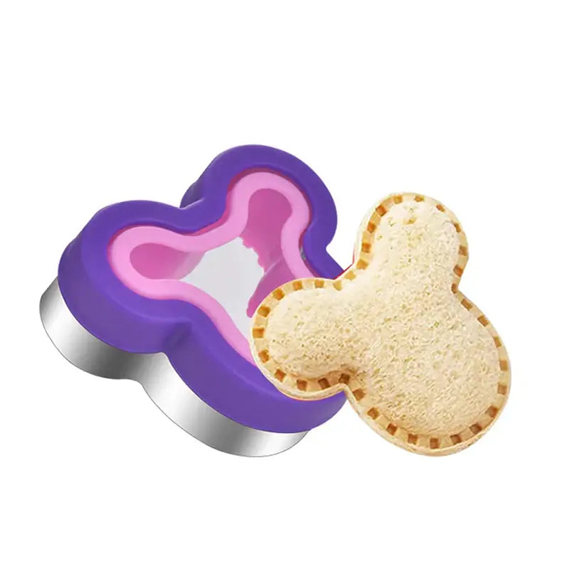 A heart shaped cookie cutter with a cookie cutter in the middle