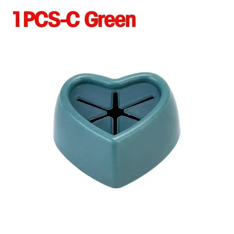 there is a heart shaped plastic container with a black cross on it