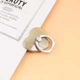 a heart shaped ring on top of a book