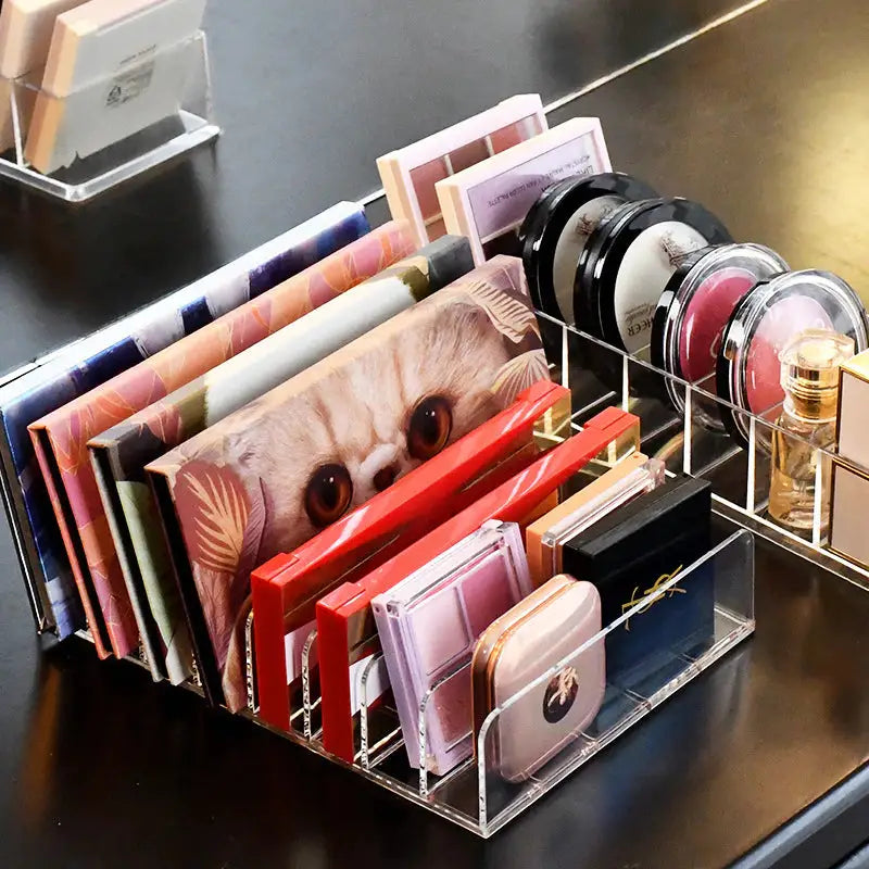 a desk with a bunch of makeup and cosmetics