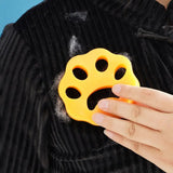 a person holding a yellow plastic object in their hand