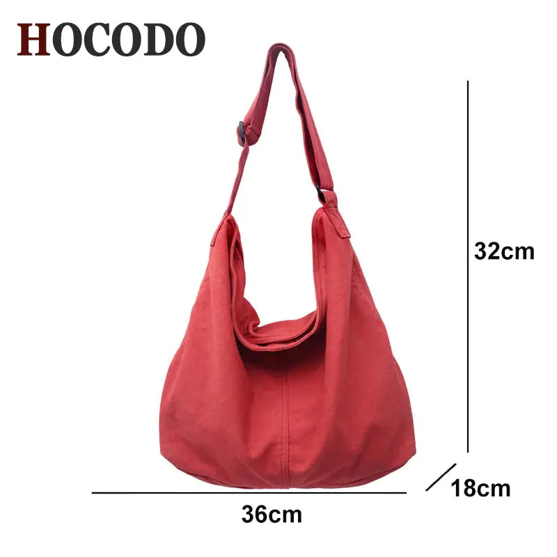 a red leather handbag with a large handle