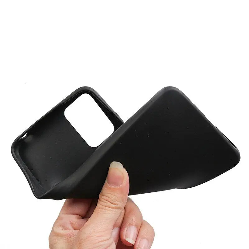 a hand holding a black plastic case