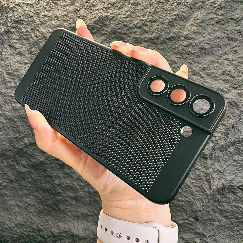 the back of a black iphone case with a hole in the middle