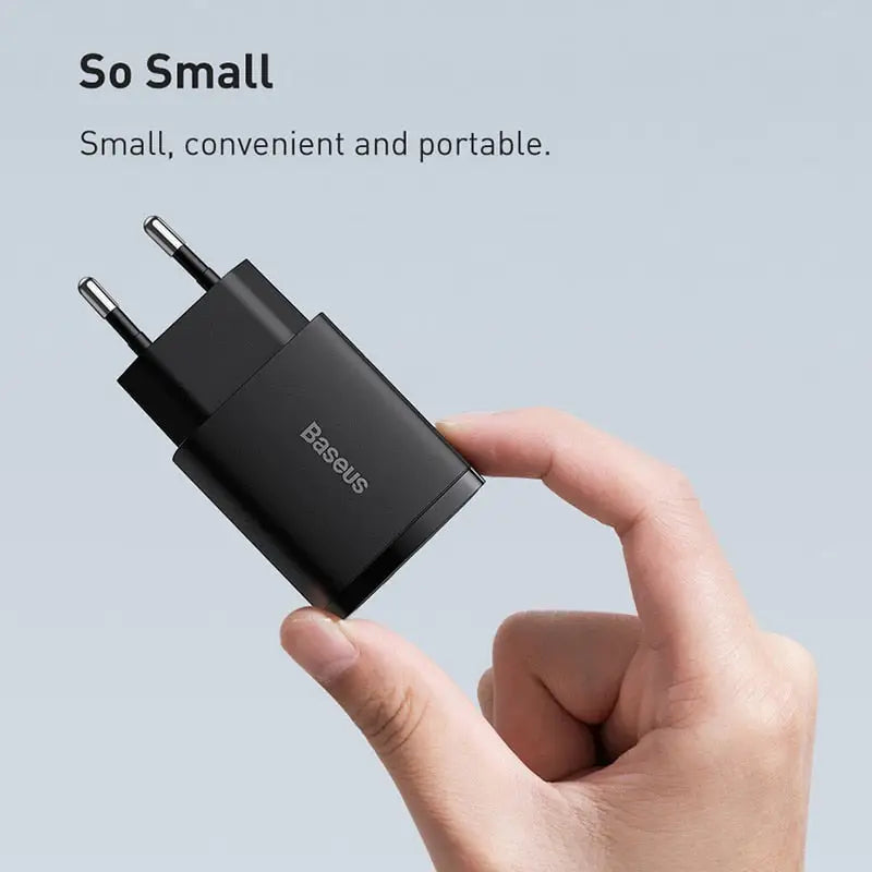 a hand holding a usb to a smart device