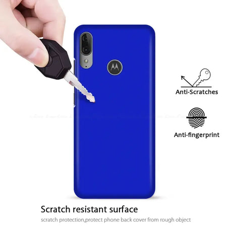 the back of a blue motorola phone case with a key