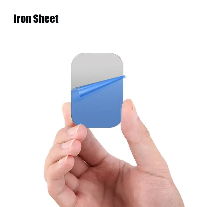 a hand holding a blue paper with the text iron sheet