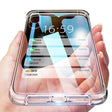 a hand holding a glass case with a phone in it