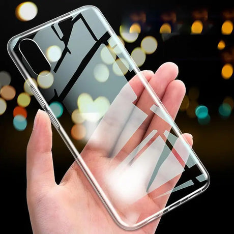 a hand holding a clear case with a phone in it