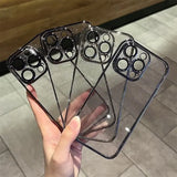 a hand holding a clear case with a black and white design
