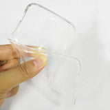 a hand holding a clear glass container