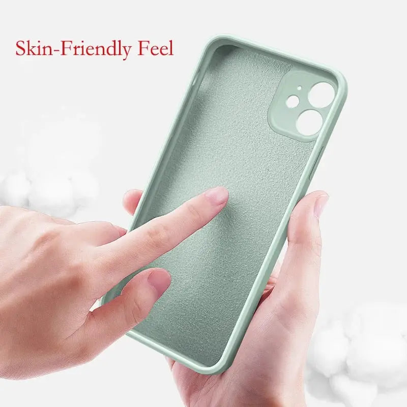 a hand holding a green iphone case