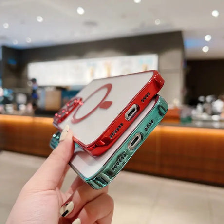 a person holding a red and green phone case