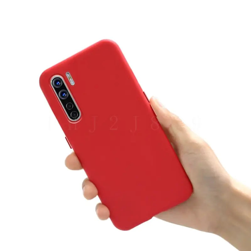 a hand holding a red iphone case