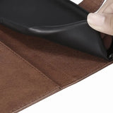 a hand holding a leather wallet