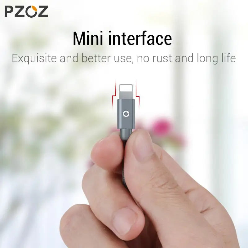 a hand holding a usb device with the text,’mini interface ’