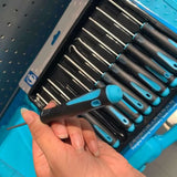 someone holding a tool set in a blue case with a lot of tools