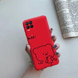 a hand holding a red phone case with a bear drawn on it