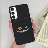 a person holding a phone case with a black cat face