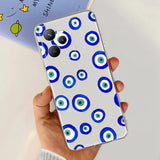 a hand holding a phone with a blue and white pattern