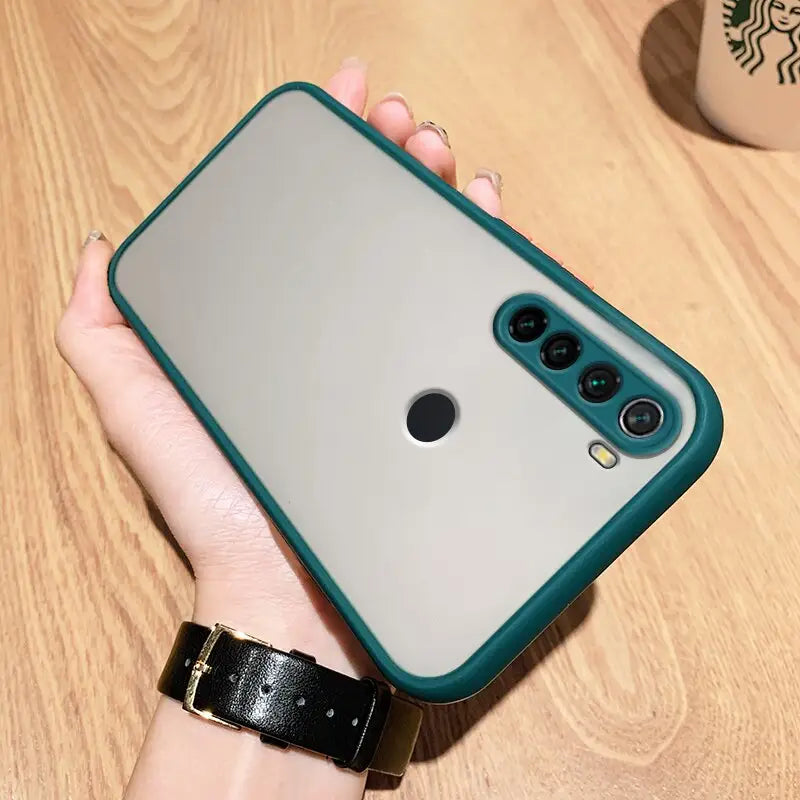 a hand holding a phone case with a camera