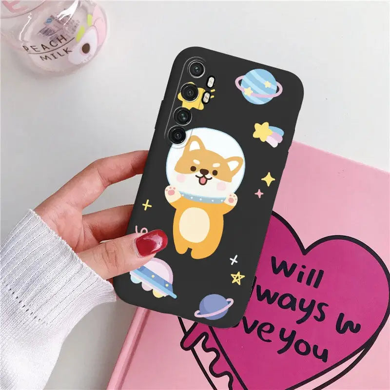 someone holding a phone case with a cartoon dog on it
