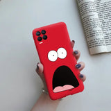 a person holding a red phone case with a cartoon face