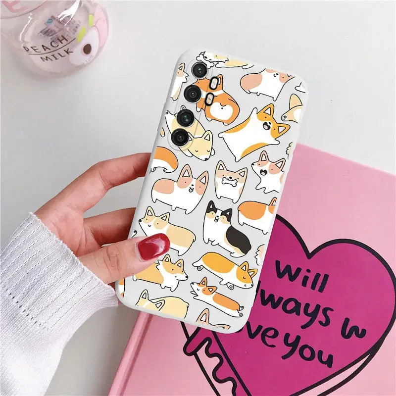 someone holding a phone case with a pattern of cats on it