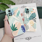 a hand holding a phone case with a colorful floral design