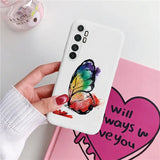a person holding a phone case with a heart painted on it