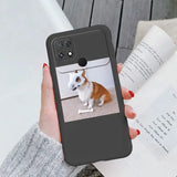 a woman holding a phone case with a dog on it