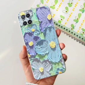 a person holding a phone case with flowers on it