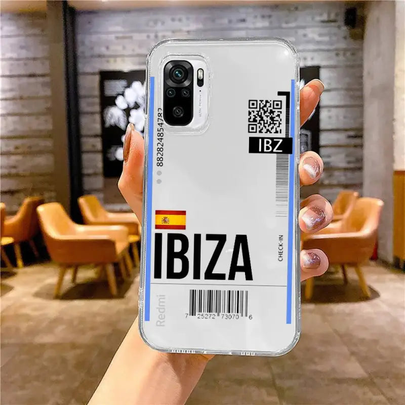 a hand holding a phone case with the logo of the brand iba