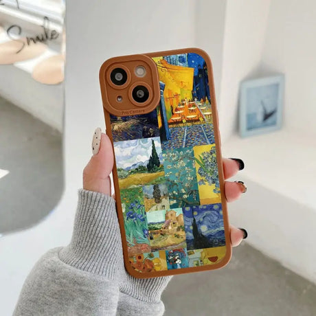 someone holding a phone case with a painting on it