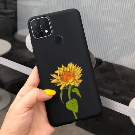 a hand holding a phone case with a sunflower on it