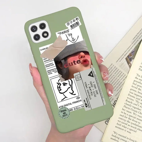 someone holding a phone case with a picture of a woman with a hat on