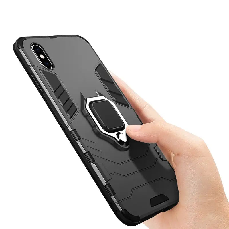 a hand holding a phone with a car mount