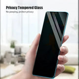 a hand holding a phone with a glass screen