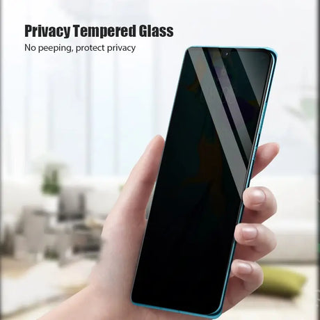 a hand holding a phone with a privacy screen