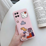 a hand holding a pink phone case with a cartoon design