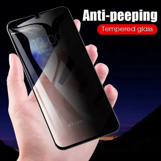 a hand holding a glass case for the iphone