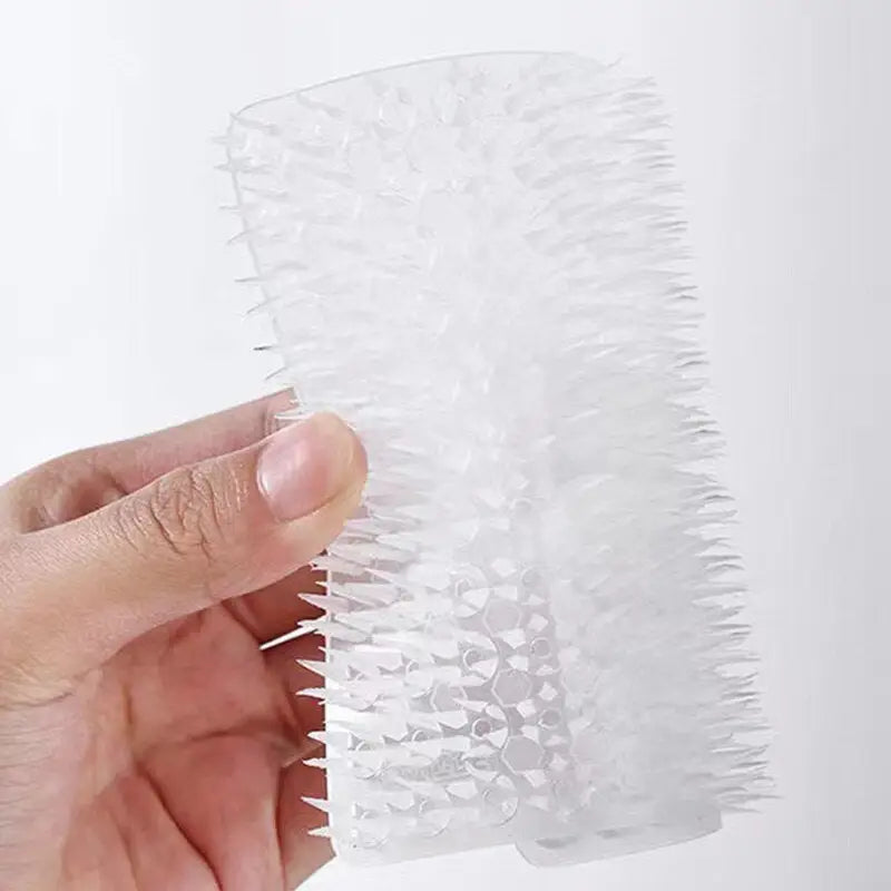 a hand holding a plastic sheet with a white background