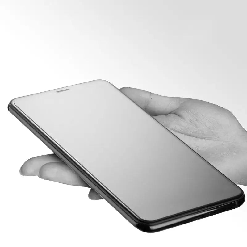 a hand holding a smartphone with a blank screen