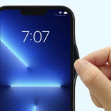 a hand holding a smartphone with the screen open