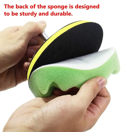 someone is holding a sponge in their hand and a sponge in their hand