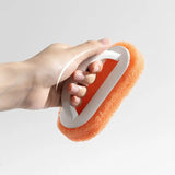 a hand holding a sponge with a sponge on it