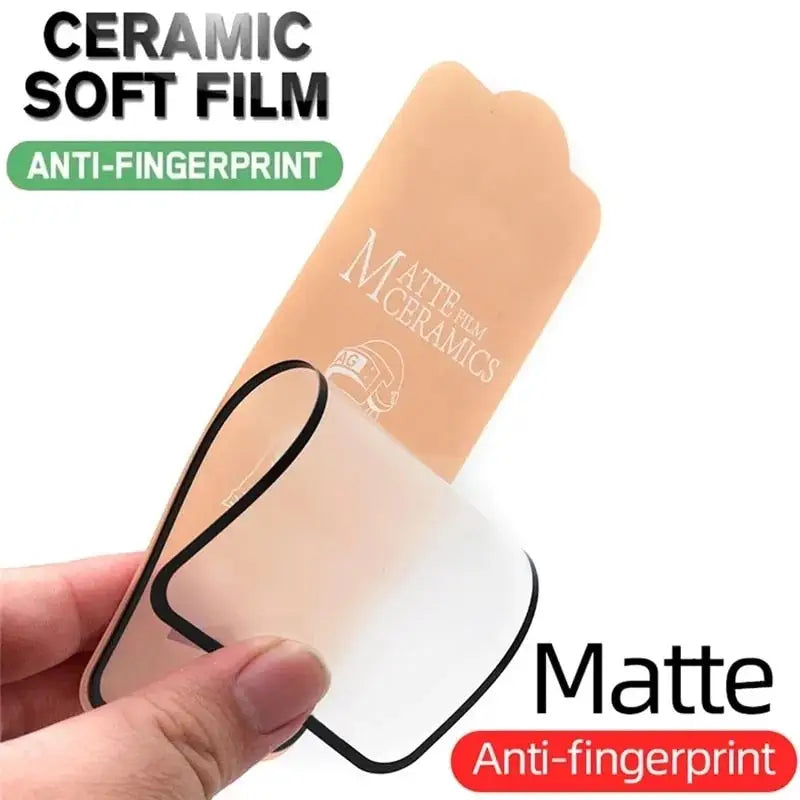 a hand holding a white and black plastic tube