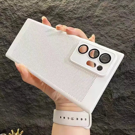 a hand holding a white iphone case